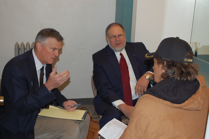 Volunteer attorneys Matt Keenan, John Solbach meeting with a Veteran